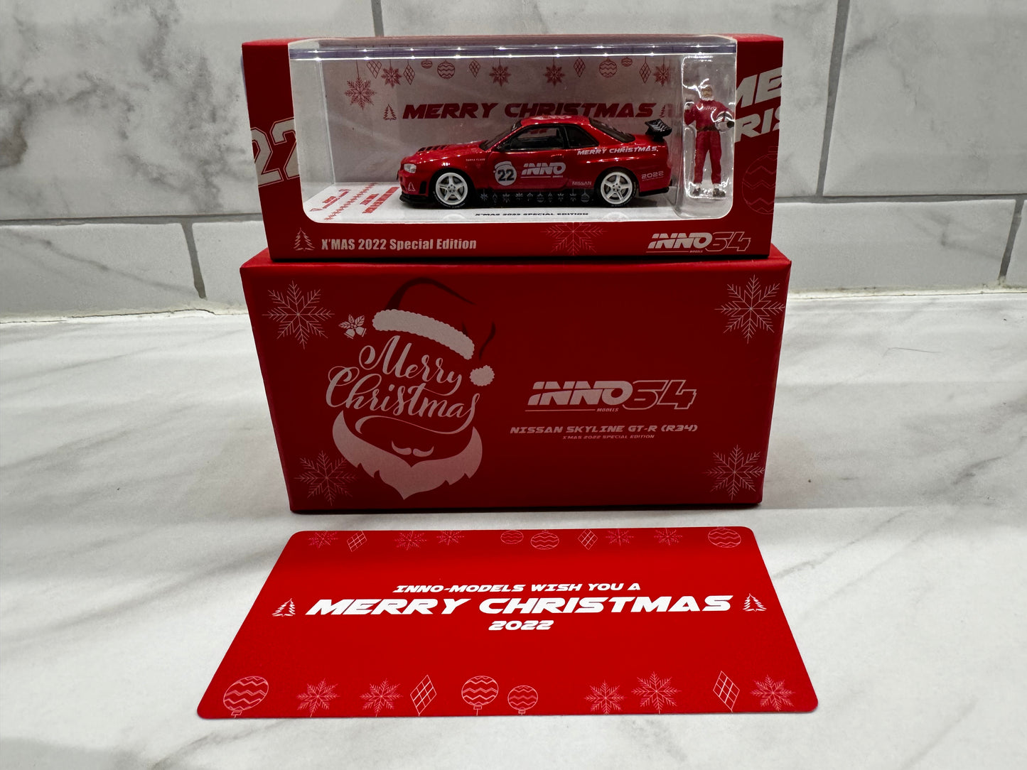 INNO64 Nissan Skyline GT-R (R34) - X-Mas 2022 Special Edition with Santa Figure