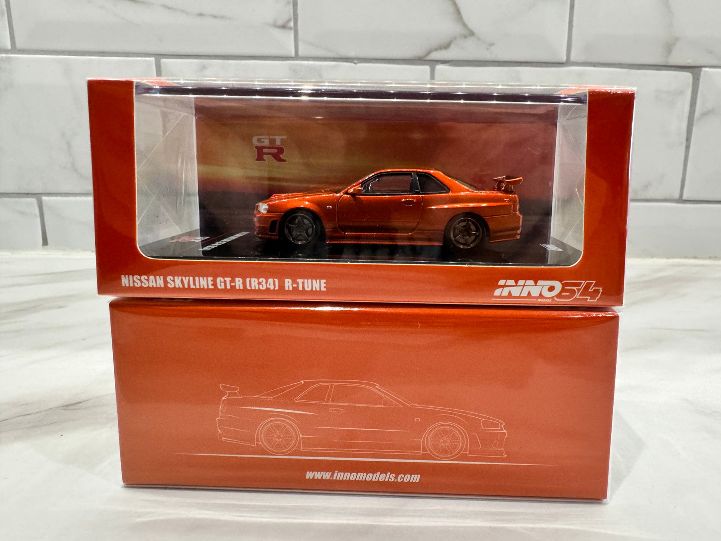 Inno64 Nissan Skyline GT-R R34 R-Tune Orange Metallic